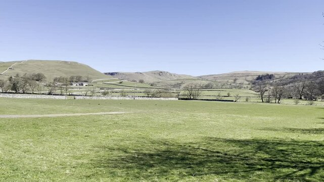 English countryside landscape with a blue clear sky in Malham cove