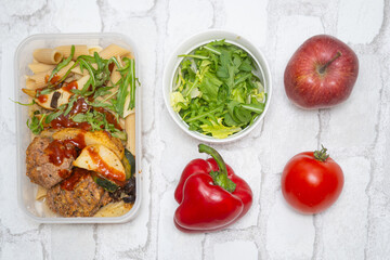 Top view of a healthy and delicious lunchbox with vegetables, fruits, and meat—perfect for work meals, meal prep, and eating healthy on the go. Ideal for fitness, wellness, and diet-focused content.
