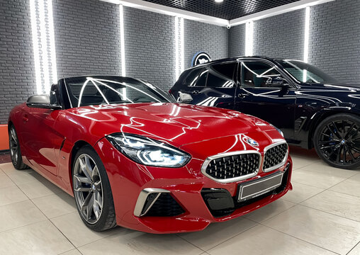 Red cabriolet BMW Z4 G29 M Sport Roadster Convertible in showroom. Exterior cabrio BMW Z4, luxury coupe manufactured by the German automobile manufacturer BMW.
