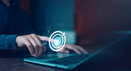 Businessman hold virtual target icons for business objective. Strategic planning for business growth and target customer group. set up business objective target goal.value, growth,	
