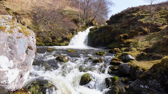 Scenic view of Scottish river and waterfalls at Bone Caves of Inchnadamph in Sutherlands highlands of Scotland UK