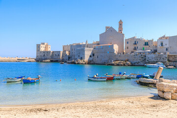Giovinazzo old town in Apulia, Italy: view of the harbor from reef with the Cathedral of Santa...
