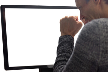 Young man looking at computer screen and feeling confused. Close-up of man at computer, seen from behind, white screen offering copy space