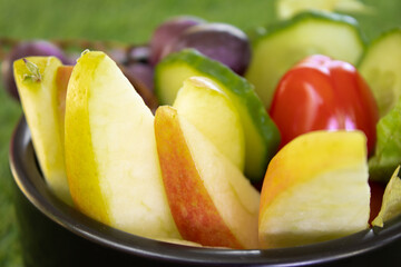 A plate with a variety of fresh fruits and vegetables, rich in vitamins. Healthy lifestyle, proper nutrition, balanced diet, organic food, vegan, nutritious, and vibrant.