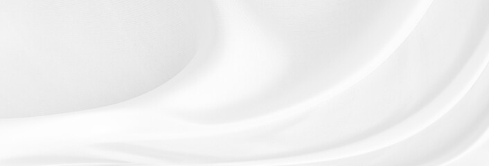 White gray satin texture that is white silver fabric silk background with beautiful soft blur...