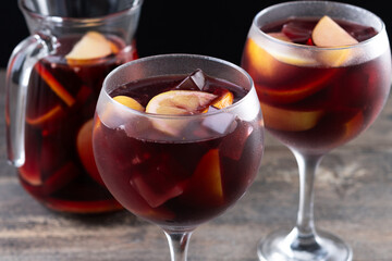 Refreshing Summer Citrus Fruit Sangria in crystal jar on wooden table