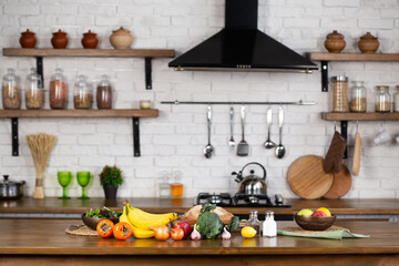 Kitchen table with various fresh vegetables and fruits for healthy and diet food with space for your product, copy space