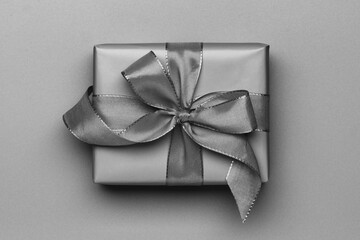 grey gift box with ribbon, close-up, top view