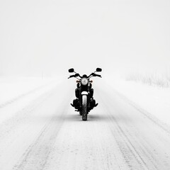 Naklejka premium Lone motorcyclist navigating a snowy road during a storm