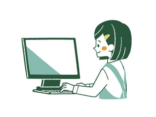 パソコンを使っているエプロンを着用した女性