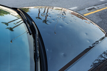 car hood hit by hail. storm damage