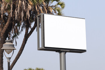 billboard on city streets, Billboard outdoor advertising, mockup billing board in front of a sky. Blank white background for branding design large hoarding, Outdoor advertising construction. india diu © Nilofar