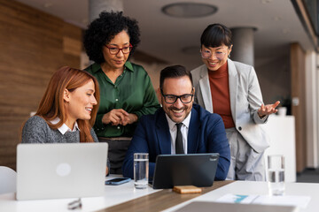 Diverse Professional Team Collaborating in Modern Office Environment
