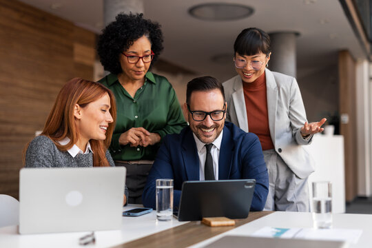 Diverse Professional Team Collaborating in Modern Office Environment