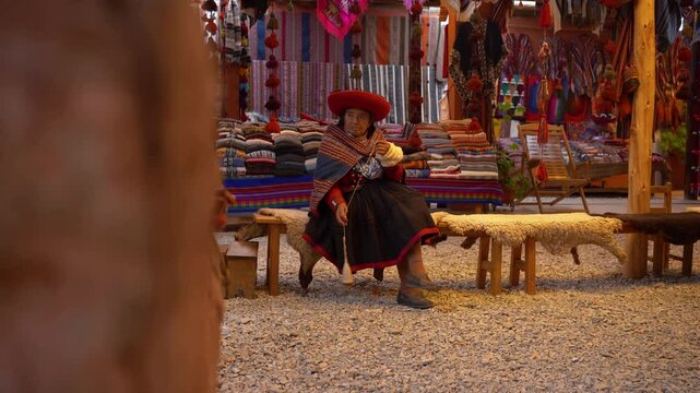 Elderly Andean Woman Handcrafting Traditional Textile Accessories at Artisan Workshop in Peru