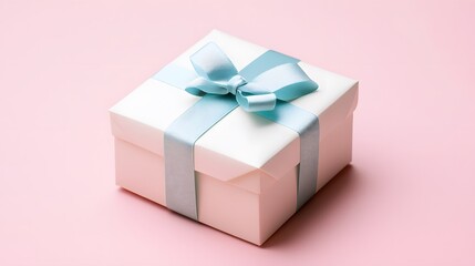 Obraz premium Elegant gift box with light blue ribbon tied in a bow, on a soft pink background, perfect for any celebration and to give as a present.