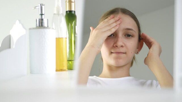 Girl use Face Cream in Mirror, Young Child Use Moisturizer for Dry Skin in Bathroom, Teenager  Applying Lotion, Beauty Cosmetics