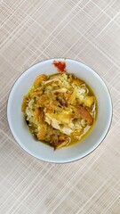 Chicken soto with potato chips topping
