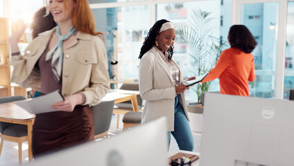 Obraz premium Woman, busy office and documents with tablet at startup with planning, schedule and deadline with team. People, tech and paperwork for task, app and happy for report with feedback at creative agency