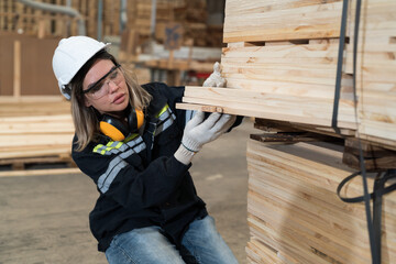 Worker processed wood in lumber factory. Warehouse and industry factory concept
