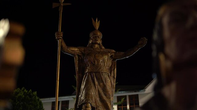 Close-up of Inca emperor Pachacutec statue at night in Aguas Calientes, Peru