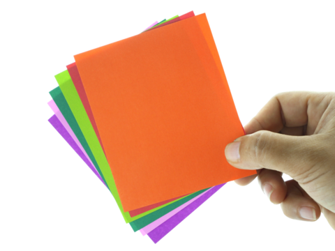 Female hand holding colorful notes isolated on white background with clipping path.