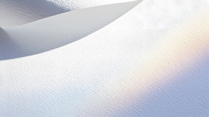 Soft white textured paper background with subtle rainbow light and shadow effect.