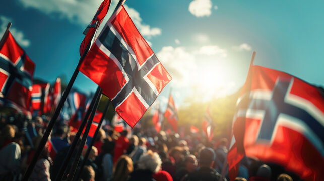 Norwegian flags fluttering against bright sunlight during national holiday commemorating Norway's constitutional independence on May 17th - Powered by Adobe