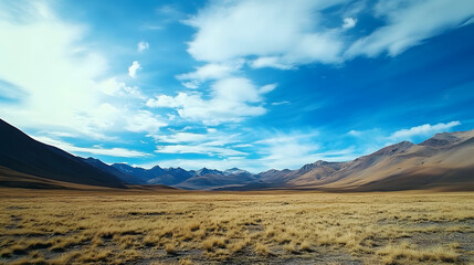 Vast Mountain Vista: A stunning panorama unfolds across a wide valley, with rolling hills beneath a dynamic sky of swirling clouds. It's a portrait of nature's vastness.