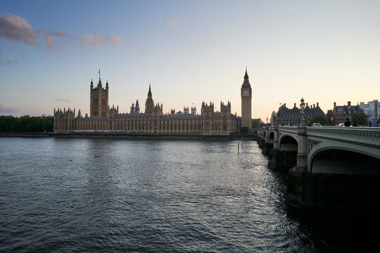 Westminster Palace and Big Ben viewed from across the River Thames at sunset. London, UK