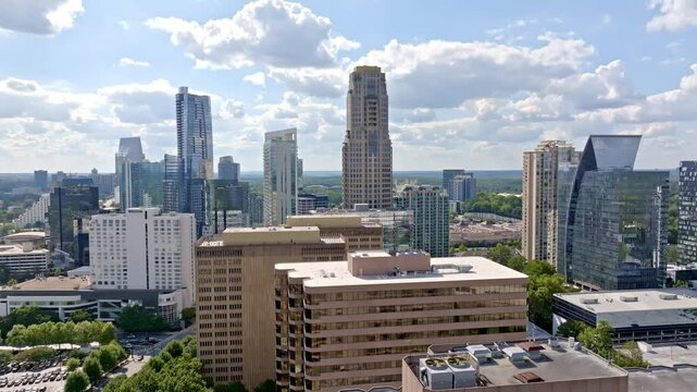 Buckhead highrise and skyline buildings under sunny sky, Atlanta, Georgia, Drone shot