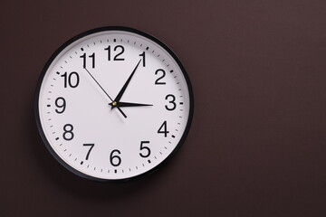 Close-up of a wall clock. The concept of time and work time is valuable for life, Alarm clock...