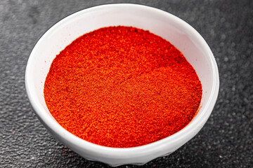 Ground hot red pepper cayenne pepper paprika spice appetizer vegetables dish organic product fresh tasty gourmet food background on the table rustic food top view copy space