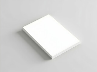 Elegant minimalistic close-up composition featuring a pristine white notepad resting on a soft gray surface creating a simple and clean aesthetic