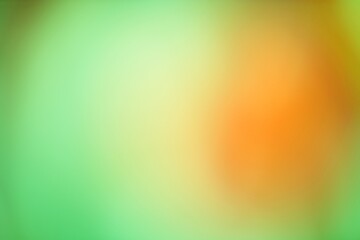 Abstract background with a soft gradient of green and orange hues