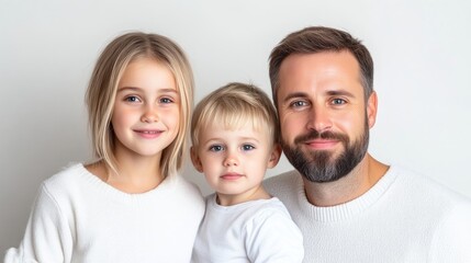 Fototapeta premium Happy family portrait. Three children and father together, smiling, in a studio setting. A picture of love, family, and togetherness