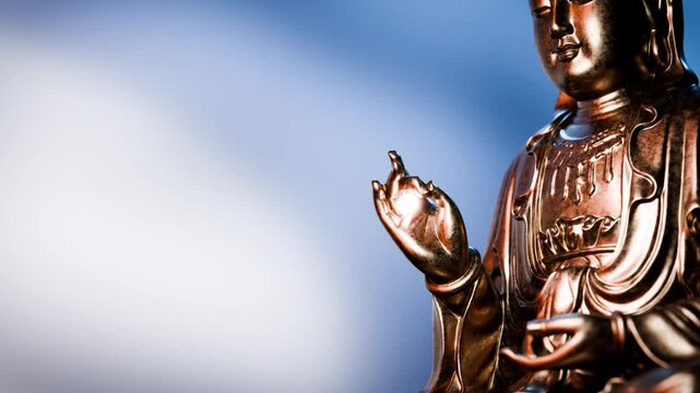 Golden buddha statue presenting vitarka mudra gesture, symbolizing teaching and discussion