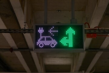 Electric car charging station sign in a carpark