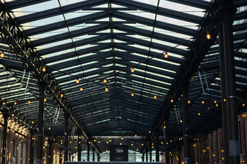 Garlands of lamps on the street. Light bulb decor, the string of lights on a urban background