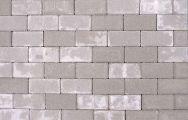 High-resolution texture of gray pavement tiles with a clean, uniform arrangement. Top view.