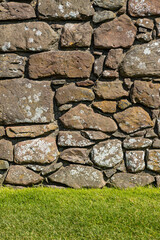 An ancient medieval brick wall tells stories of the past. Its worn textures and weathered details evoke legends and mysteries held within the stones over centuries