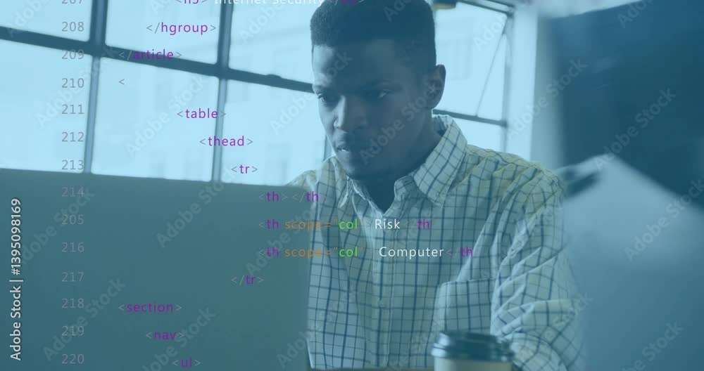 Poster working in modern office, man coding with colorful animation overlay on laptop