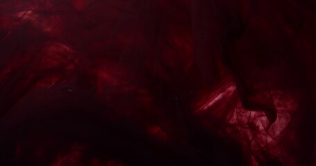 Fototapeta premium Spreading paint, abstract colors swirling and exploding. An organic background for visuals and motion graphics.