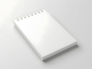 Minimalist Aesthetic, Close-Up of a Premium White Notepad with Spiral Binding on a Soft Grey Surface, Ideal for Mockups and Creative Projects, Highlighting Simplicity and Clean Design