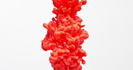 Bright paint bursts into the white water with a powerful pressure, gurgling strongly and creating a beautiful abstract pattern. An organic background for visuals and motion graphics.