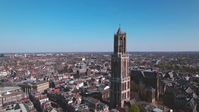 Aerial drone view of typical Dutch city skyline, Utrecht cityscape with renovated Dom tower, canals and houses, Holland, Netherlands