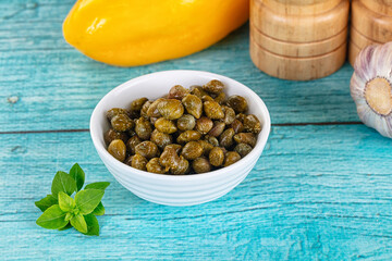 Pickled canned capers in the bowl