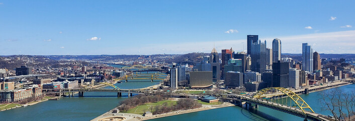 Pittsburgh, Pennsylvania, USA &ndash; April 10, 2024: Panoramic view of Point State Park where the Allegheny and Monongahela Rivers meet to form the Ohio River, with Acrisure Stadium and downtown in view.