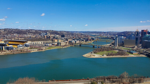 Pittsburgh, Pennsylvania, USA &ndash; April 10, 2024: Panoramic view of Point State Park where the Allegheny and Monongahela Rivers meet to form the Ohio River, with Acrisure Stadium and downtown in view.