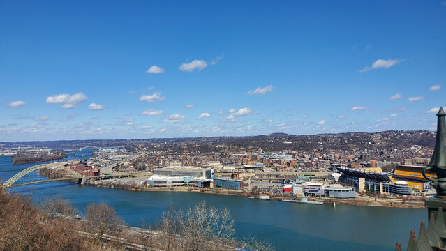 Pittsburgh, Pennsylvania, USA &ndash; April 10, 2024: Aerial view of Point State Park, the confluence of Pittsburgh&rsquo;s three rivers, Acrisure Stadium, and the downtown skyline under a vibrant spring sky.